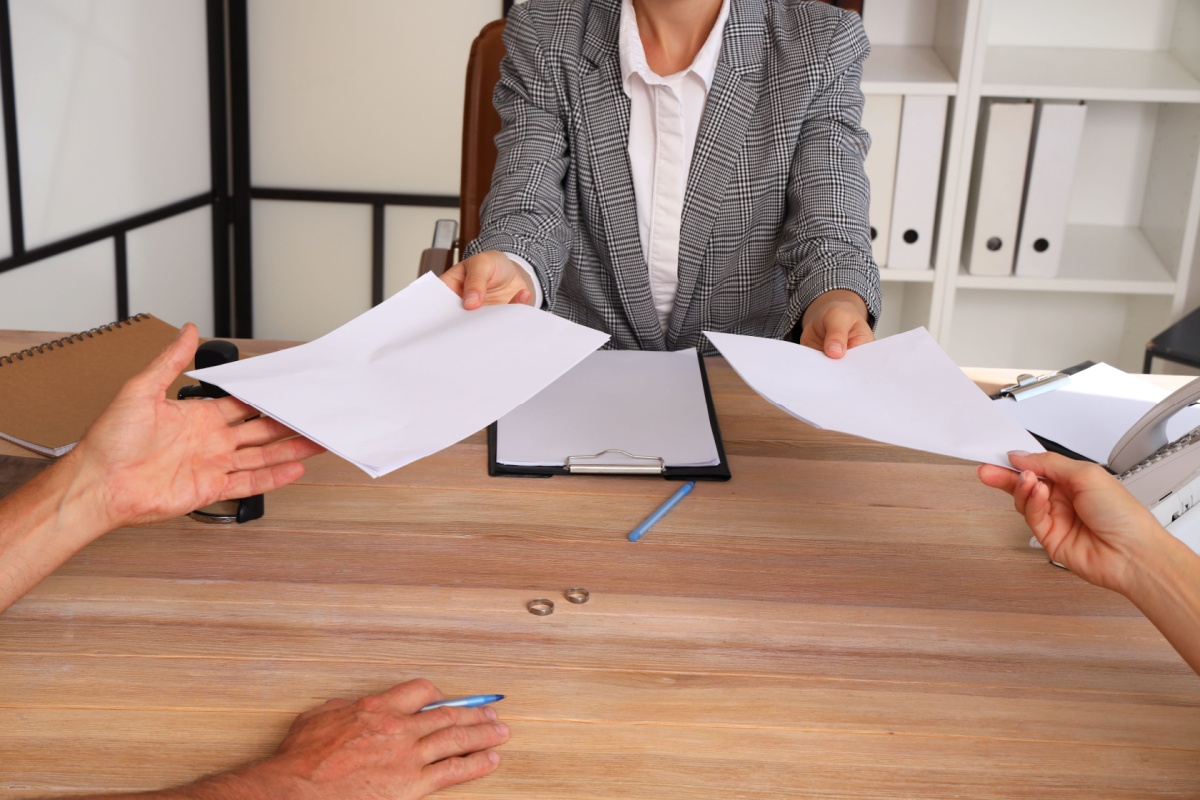 Mature couple receiving divorce paperwork