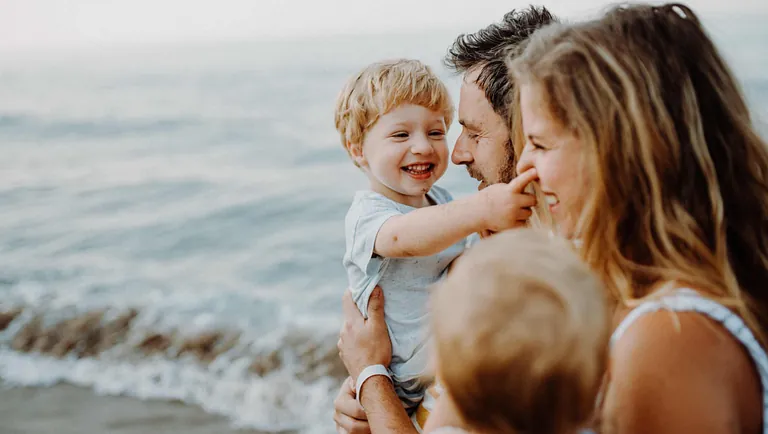 young family on the beech